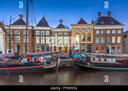 Historic boats and buildings at Hoge der Aa quay in Groningen city center, Netherlands Stock Photo