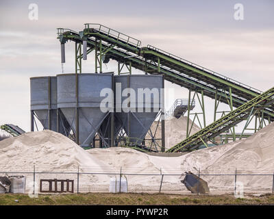Mining belts are sorting sand on a construction site Stock Photo