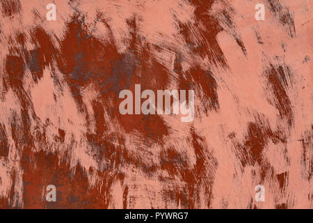 rusty metal surface painted with red color with brush strokes. close up abstract background or backdrop Stock Photo