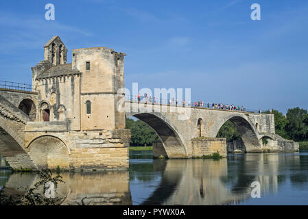 Tourists in summer visiting the Pont Saint-Bénézet / Pont d'Avignon over the river Rhône, Avignon, Vaucluse, Provence-Alpes-Côte d'Azur, France Stock Photo