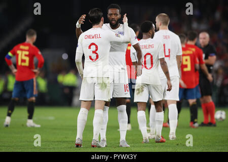 England striker coach Allan Russell with England coach Steve Holland (right) celebrates with fans after England's win against Spain. Stock Photo