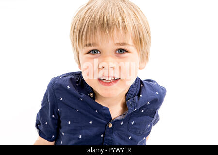 cute five year old boy studio portrait on white background with his ...