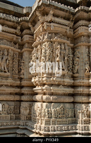 Stone Carved Figures on Old Jain Temple, Ranakpur, Rajasthan, India Stock Photo