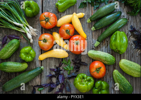 Overhead view of freshly picked produce on old wood background. Stock Photo