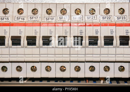Automatic fuse electrical connector in power lines located inside of switch control panel board. Stock Photo