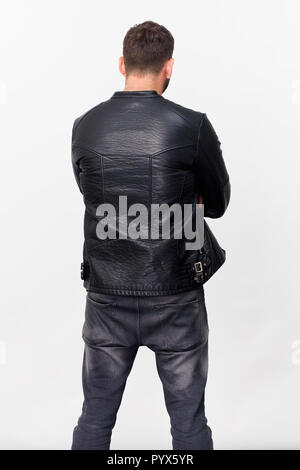 Tall man back portrait in black jacket, isolated on white Stock Photo