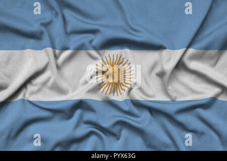 Argentina flag  is depicted on a sports cloth fabric with many folds. Sport team waving banner Stock Photo