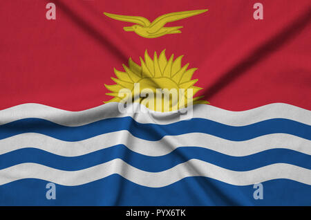 Kiribati flag  is depicted on a sports cloth fabric with many folds. Sport team waving banner Stock Photo