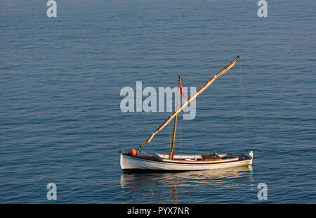 A small sailing boat in the Aegean Sea Stock Photo