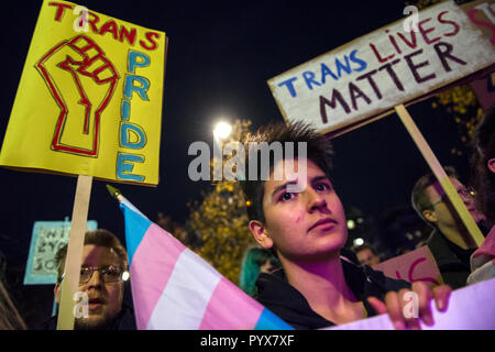 Protesters are seen holding placards during the protest. Polish LGBTQ organizations protested under the slogan We Will Not Be Erased outside the US embassy while the Activists say the administration of President Donald Trump is trying to deprive the Trans- and intersex persons of legal entity and it is a huge step back in the legal protection of minorities, but above all, a direct threat to the health and life of people who are trans- and intersex. There is no consent'. The New York Times reached a government note in which a suggestion appeared that the 'gender' (cultural part of gender identi Stock Photo