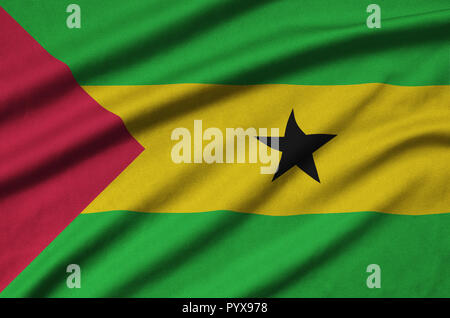 Sao Tome and Principe flag  is depicted on a sports cloth fabric with many folds. Sport team waving banner Stock Photo