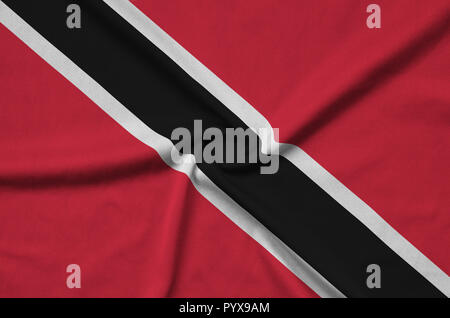 Trinidad and Tobago flag  is depicted on a sports cloth fabric with many folds. Sport team waving banner Stock Photo