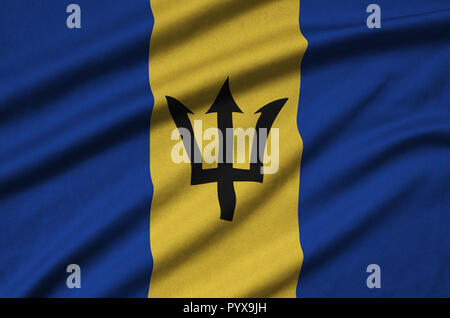 Barbados flag  is depicted on a sports cloth fabric with many folds. Sport team waving banner Stock Photo