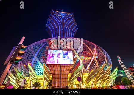 Macau, China - December 8, 2016: Grand Lisboa Casino at night, the largest casino in the world by extension that includes the tallest tower in Macao and a colorful giant dome. Stock Photo