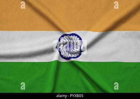 India flag  is depicted on a sports cloth fabric with many folds. Sport team waving banner Stock Photo