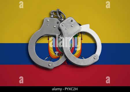 Ecuador flag  and police handcuffs. The concept of observance of the law in the country and protection from crime. Stock Photo