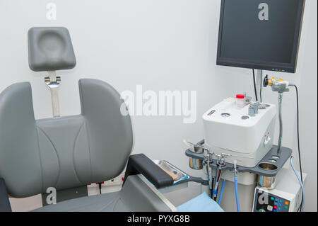 Interior of modern ENT clonic. Professional EVO ENT Medical Devices Workstation and chair in office. Ear Nose and Throat Medical equipment. Washing sy Stock Photo