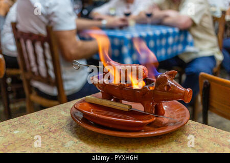 Flaming Grilled Chourica Sausage at La Recova Restaurant, Malaga Andalusia, Spain Stock Photo