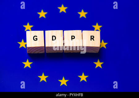 GDPR Word Written In Wooden Cube on EU flag background Stock Photo