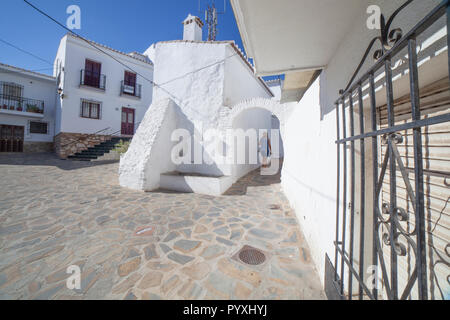 Tourist mature woman visiting Comares, white village up on the hill of Malaga mountains, Andalusia, Spain Stock Photo