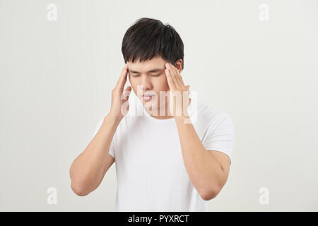 a young man suffering from headache Stock Photo