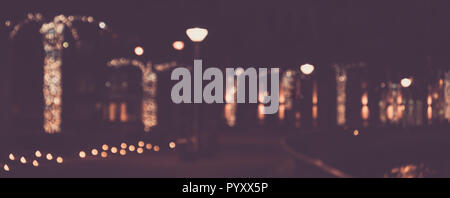 Blurred abstract urban background, bokeh of city lights, vintage or retro color tone. Stock Photo