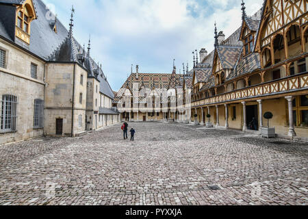 Beaune (central eastern France): Hospices de Beaune’s building viewed from the inner courtyard, with its polychromatic glazed tile roofs Stock Photo