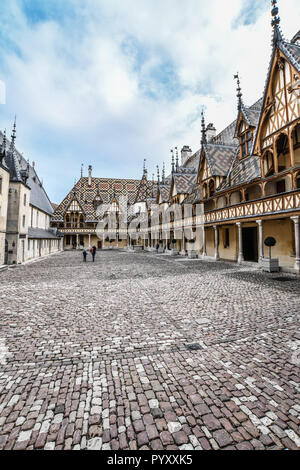 Beaune (central eastern France): Hospices de Beaune’s building viewed from the inner courtyard, with its polychromatic glazed tile roofs Stock Photo