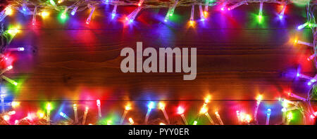 Colorful String Lights On Wooden - Christmas Frame Stock Photo