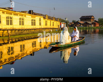 Shikaras are the traditional way to travel on Dal Lake Stock Photo