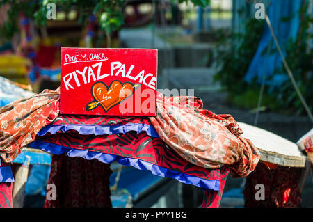 Shikaras, recognisable by artfully painted plates, are the common transport for people and goods on Dal Lake Stock Photo