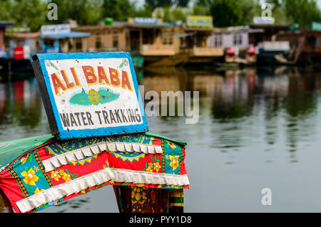 Shikaras, recognisable by artfully painted plates, are the common transport for people and goods on Dal Lake Stock Photo