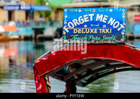 Shikaras, recognisable by artfully painted plates, are the common transport for people and goods on Dal Lake Stock Photo