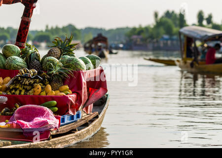 Shikaras are the common transport for people and goods like fruits and vegetables on Dal Lake Stock Photo