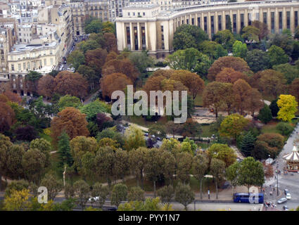 A small forest of trees give a lovely display of autumnal colours as seen from the Eiffel tower in Paris, France.