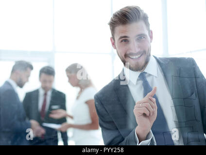 successful businessman touching his finger to the glass Board. Stock Photo