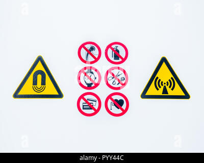 Isolated Warning caution signs at the entrance to the controlled radioactive area lightbox in hospital Stock Photo