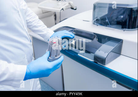 Close up scientist doing chemical test in modern laboratory. Selective focus Stock Photo