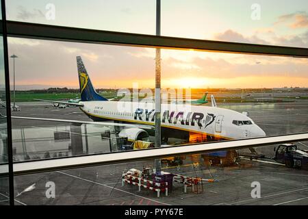 Ryanair passenger plane jet aircraft airplane on runway apron between flights seen from boarding gates of Dublin Airport Terminal Building, Ireland