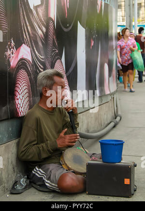 Bangkok - 2010: One man band busker along the streets of Bangkok Stock Photo