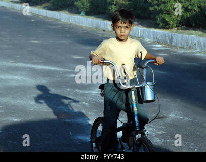 child riding bicycle, union carbide gas leak tragedy, Bhopal, madhya pradesh, India, Asia Stock Photo
