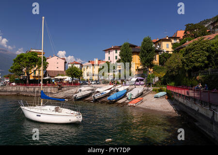 Yacht moored in Varenna harbour on Lake Como, Italy Stock Photo