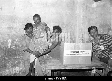 Disabled man lifted for voting, Mumbai, Maharashtra, India, Asia 1900s