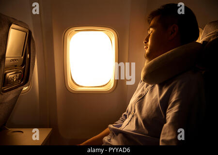 Young men by plane Stock Photo