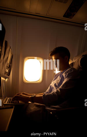 Young men by plane Stock Photo