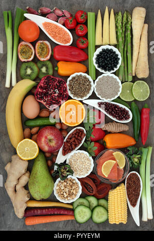 Super food concept for a healthy life with fruit, vegetables, fish, dairy, herbs, spices, nuts, legumes, seeds and cereals, high in antioxidants, anth Stock Photo