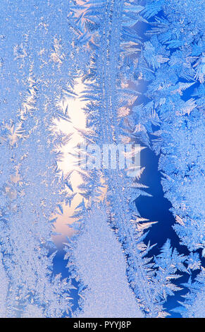 Frost forms in patterns on window glass on a cold winter morning Stock Photo