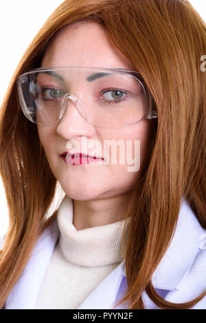 Studio shot of face of woman doctor wearing protective glasses  Stock Photo