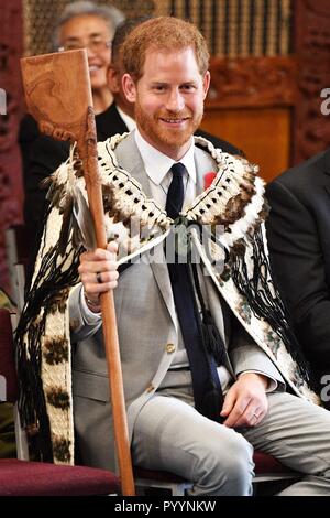 The Duke of Sussex is given a Maori Tewha Tewha weapon during a visit to Te Papaiouru, Ohinemutu, in Rotorua, before a lunch in honour of Harry and Meghan, on day four of the royal couple's tour of New Zealand. Stock Photo