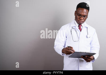 Young African man doctor against white background Stock Photo